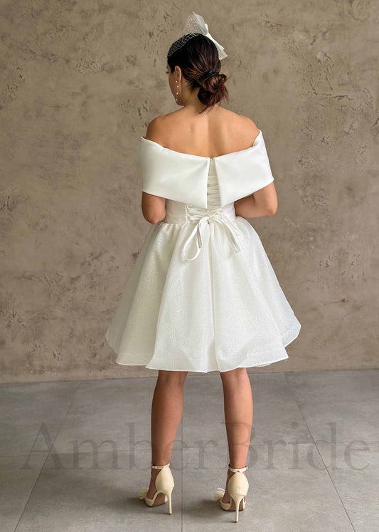 Elegant Knee-Length Dress with Satin Bow and Sparkling Organza Skirt