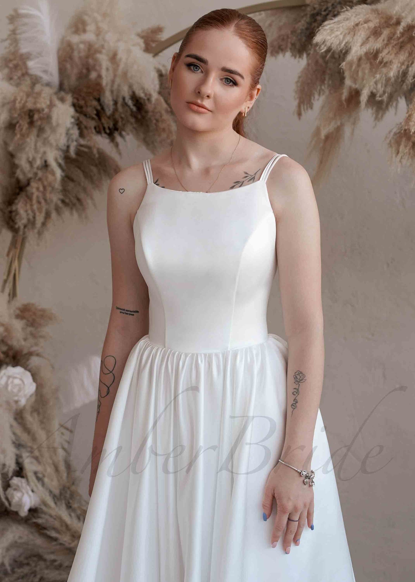 Minimalist Satin Wedding Dress with Spaghetti Straps and Backless Design