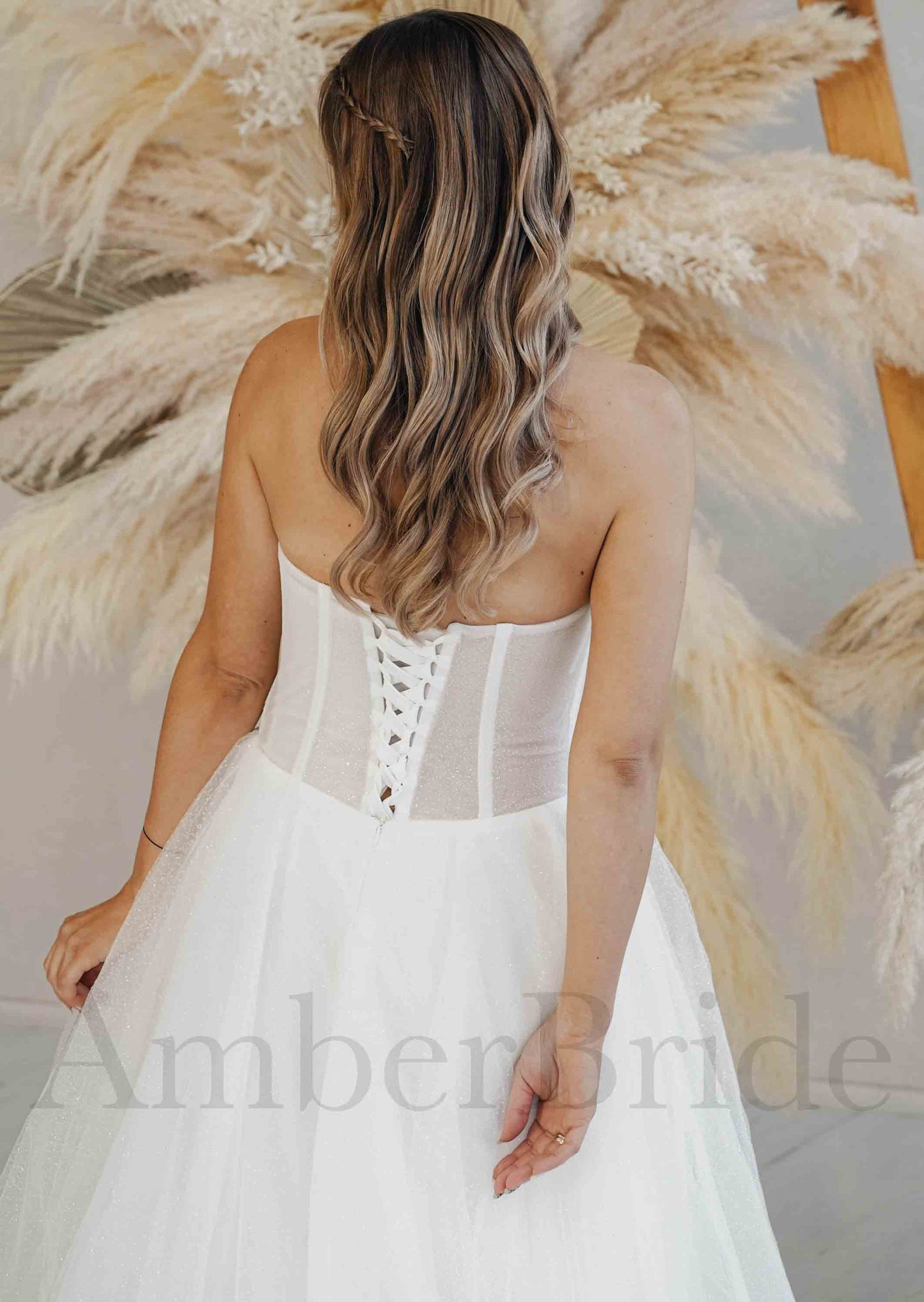 Modern A-Line Strapless Wedding Dress with Deep V Neckline and Tulle Skirt