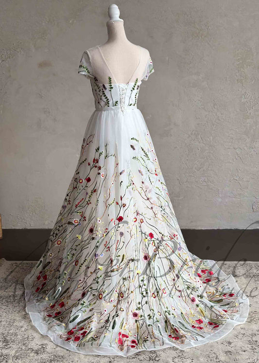 Romantic A-Line Wedding Dress with Colorful Embroidered Flowers – front view, on dress form | AmberBride