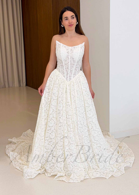 Strapless Full Lace Wedding Dress with Basque Waistline and Long Cathedral Train – front view | AmberBride