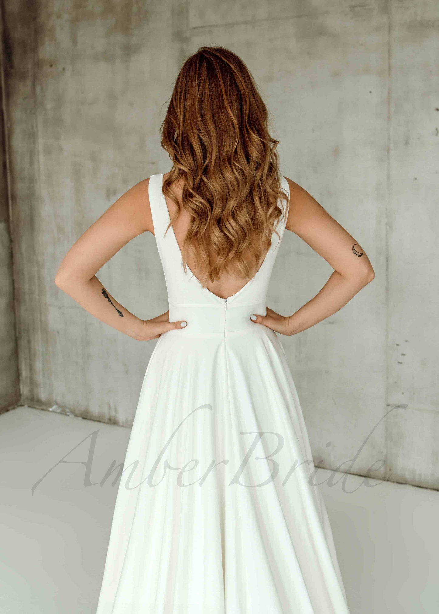 Minimalistic A Line Satin Wedding Dress with Deep V Neck and Backless Design