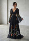 Black A-line gown with V-neck, flowing bell sleeves, and vibrant floral embroidery on chiffon fabric.