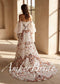 Strapless boho wedding dress with colorful floral embroidery, detachable sheer puff sleeves, and a long flowing train.