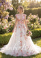 A-line tulle wedding dress with a V-neck, cap sleeves, and colorful floral embroidery in a garden setting.