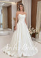 A-line satin wedding dress with a strapless, pleated sweetheart corset bodice and a full, flowing floor-length skirt.