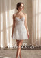 Short white strapless mini dress with corset bodice, floral lace embroidery, and thin spaghetti straps.