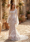 Ivory mermaid wedding dress with square neckline, bell sleeves, and intricate white floral embroidery on nude lining.