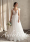 White A-line wedding dress with a sheer lace bodice, feather-adorned straps, feather waist detail, and tulle skirt.