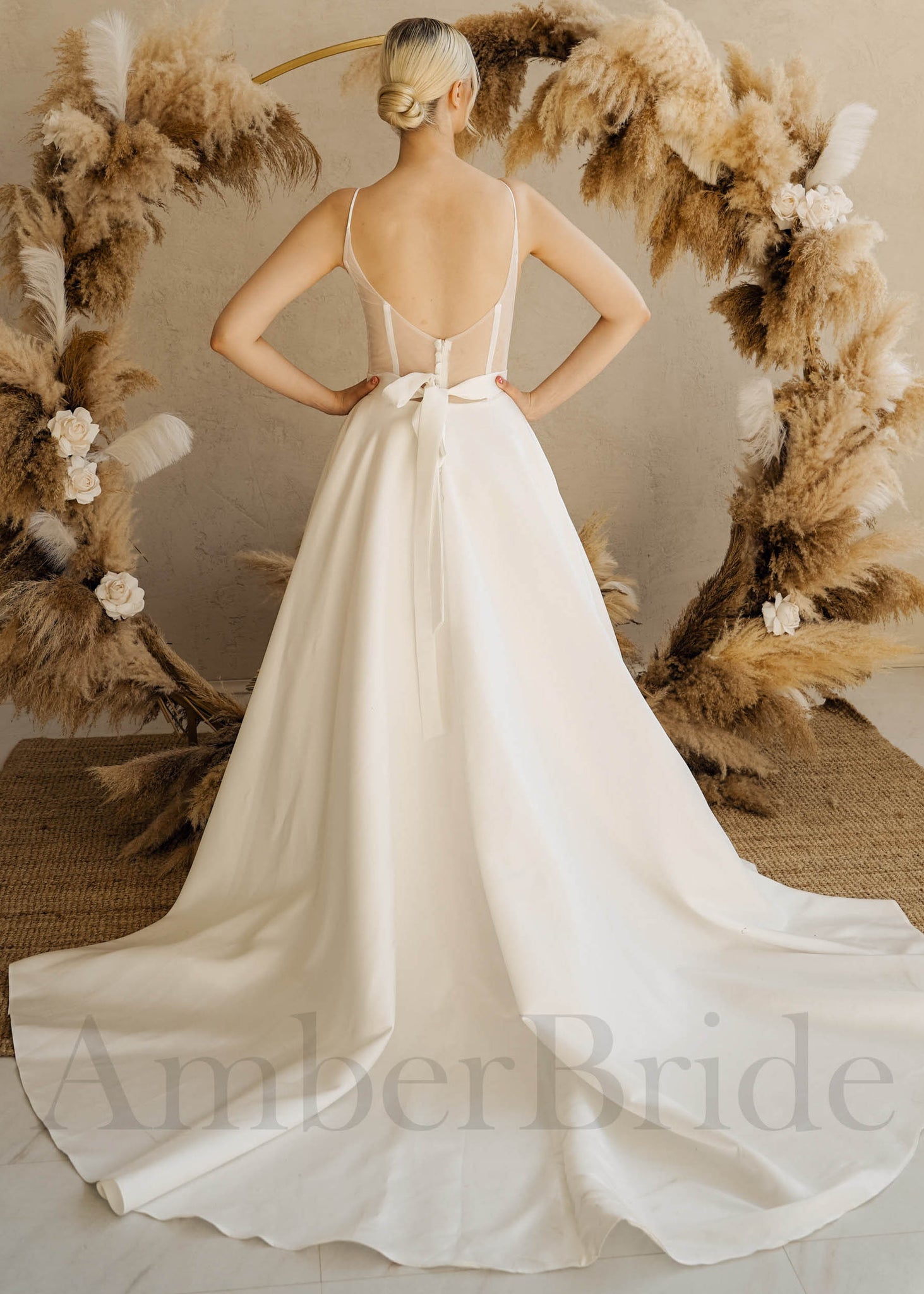 Minimalist A Line Satin Wedding Dress with Spaghetti Straps and Backless Design