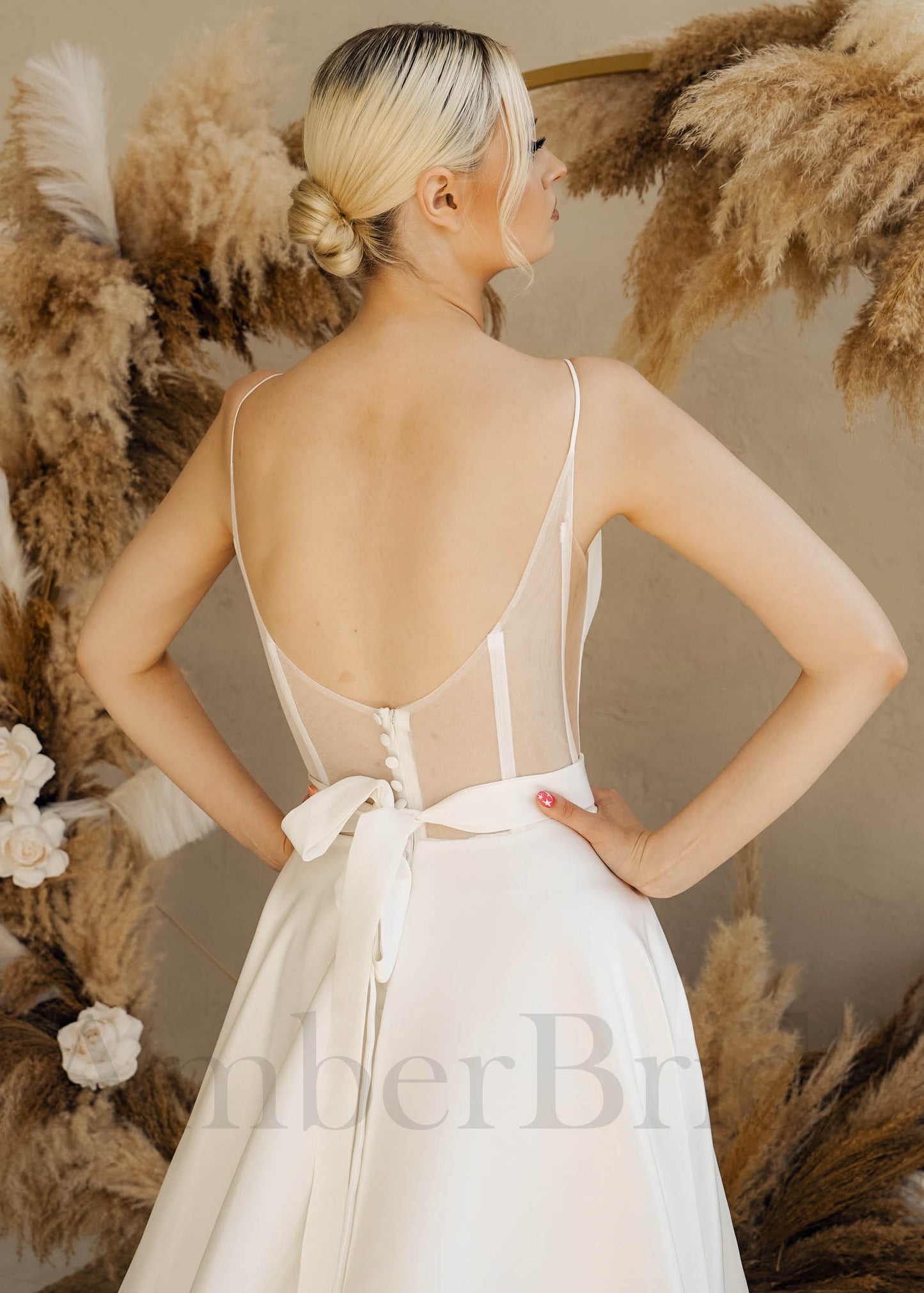 Minimalist A Line Satin Wedding Dress with Spaghetti Straps and Backless Design