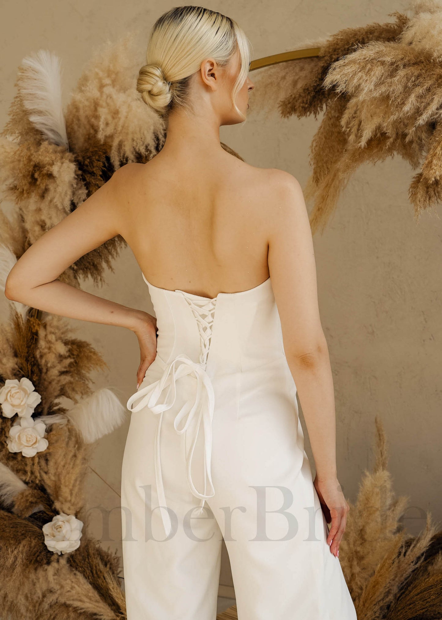 Simple Satin Bridal Jumpsuit with Strapless Deep-V Neck and Corset