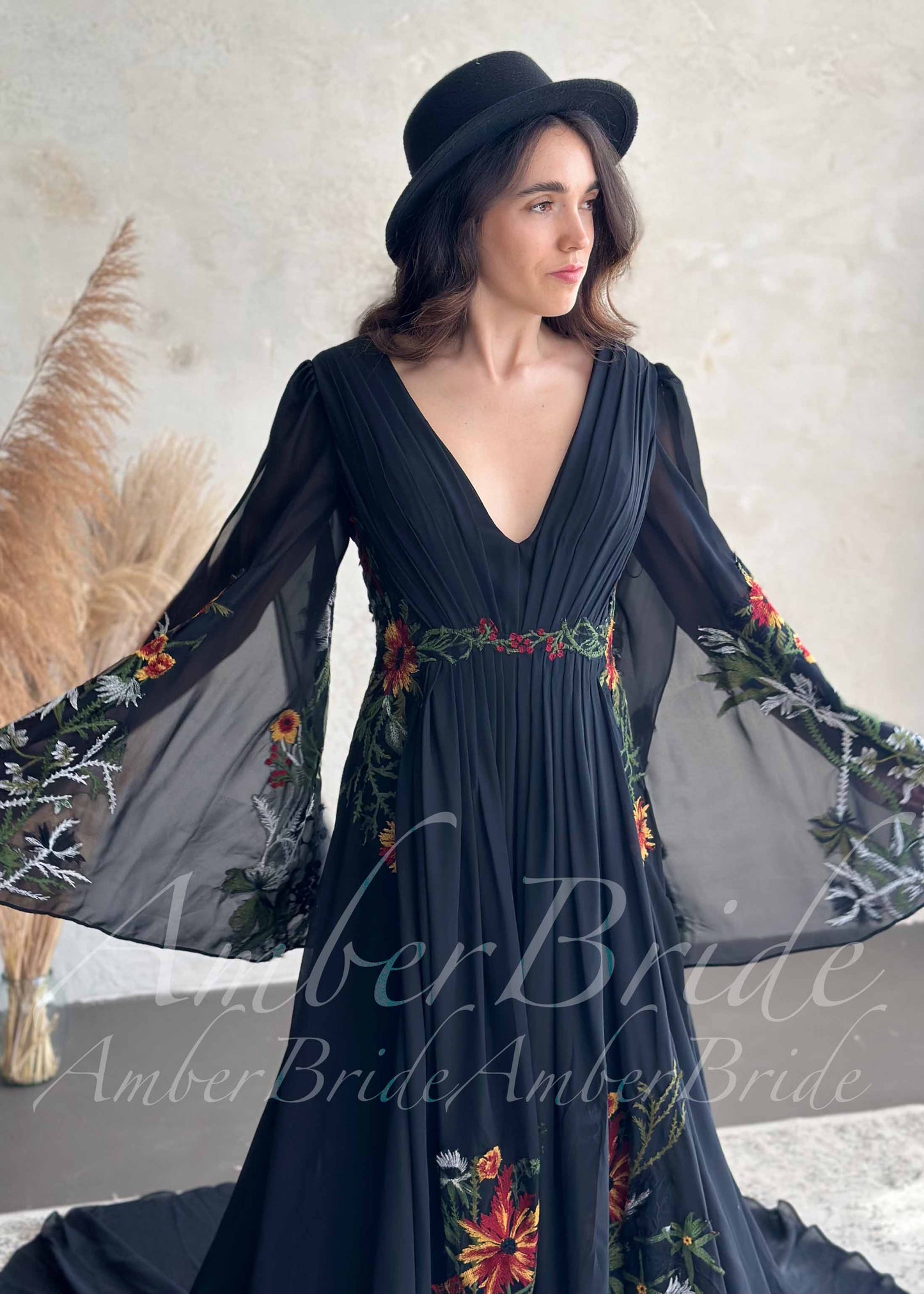 Bohemian Black A-Line Wedding Dress with Floral Embroidery and Flowing Bell Sleeves