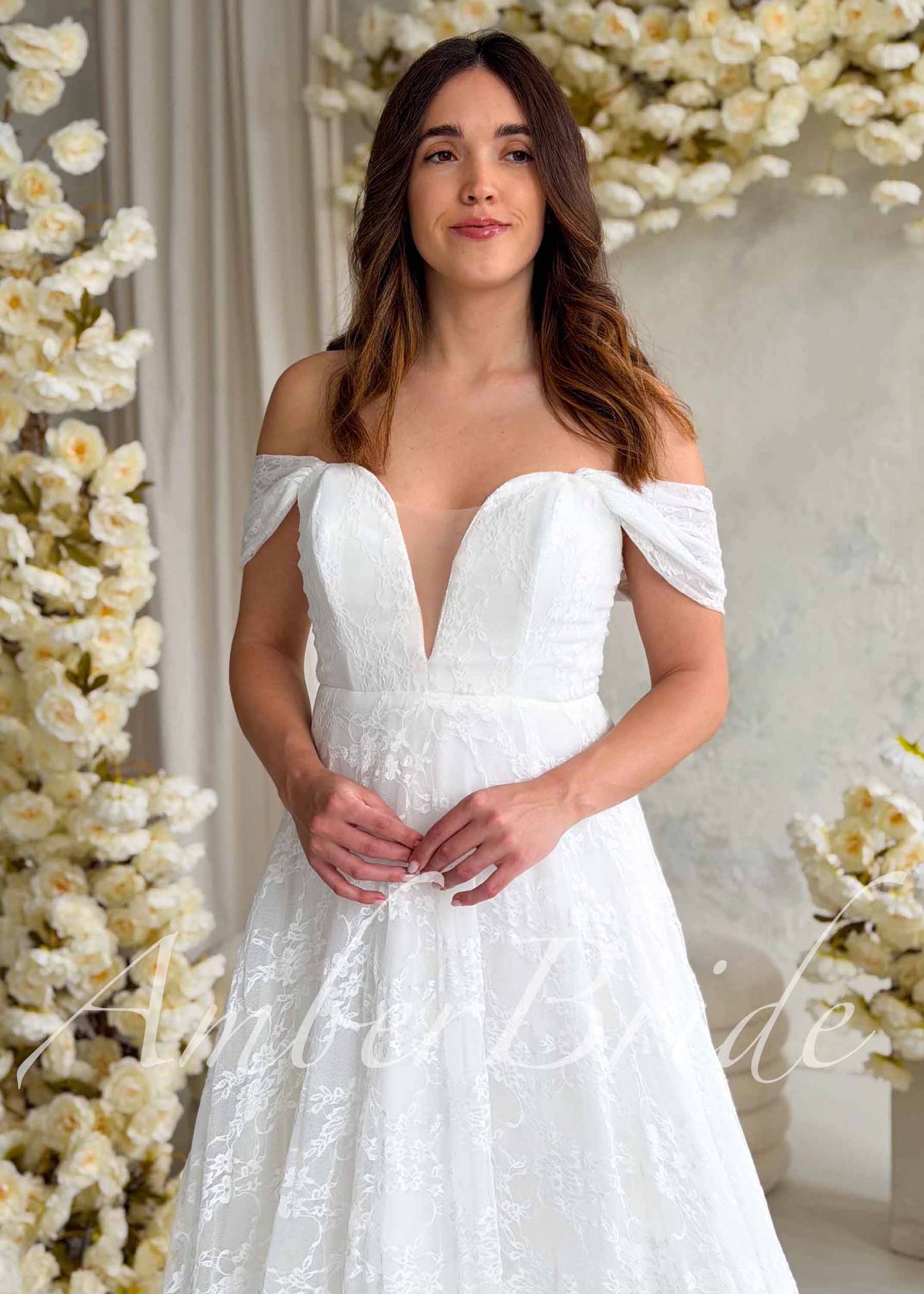 Romantic A-Line Lace Wedding Dress with Off-Shoulder Sleeves and Deep V-Neckline