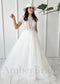 Boho A-line wedding dress with a lace high-neck bodice, short sleeves, and a full, flowing tulle skirt.