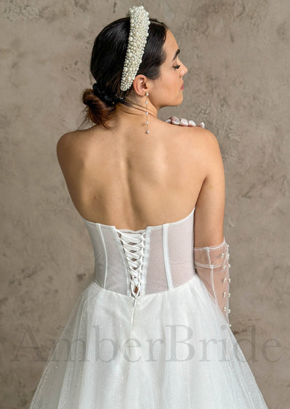 Modern A-Line Strapless Wedding Dress with Deep V Neckline and Tulle Skirt
