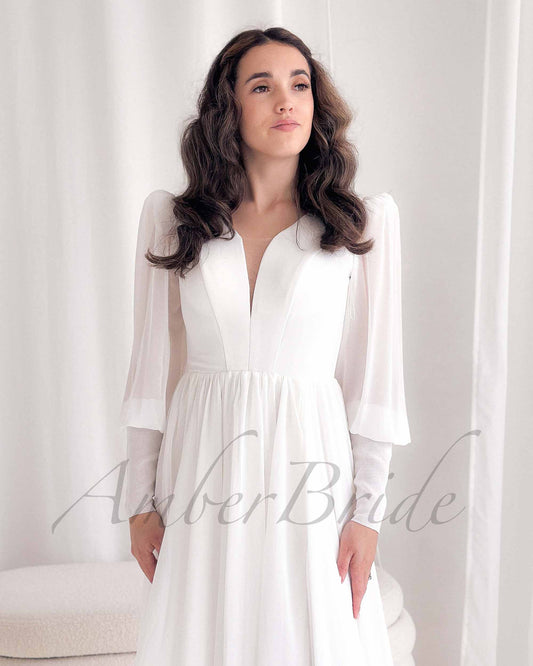 Minimalist A-Line Chiffon Wedding Dress with Long Puffy Sleeves and Deep V-Neck – bodice detail | AmberBride