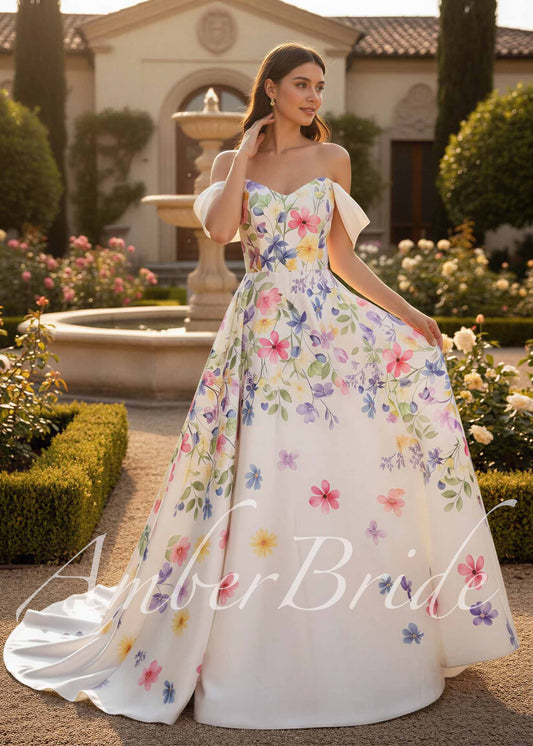 A-line satin wedding dress with colorful floral print, sweetheart neckline, and detachable off-shoulder sleeves.