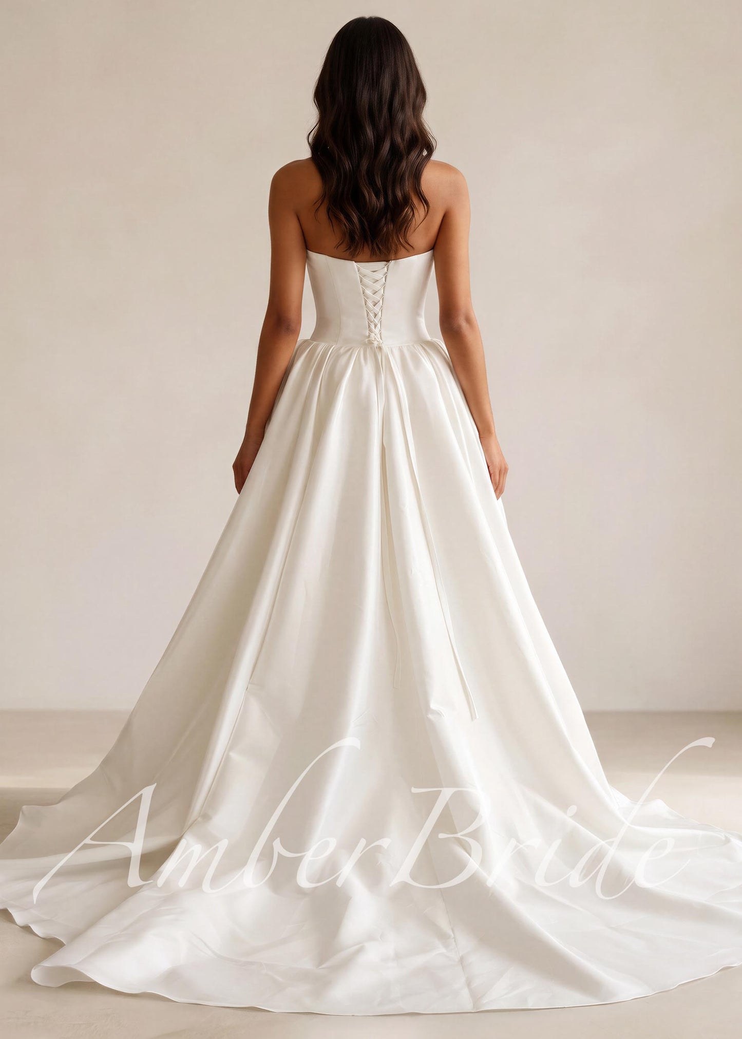 Strapless satin bridal ball gown with a full skirt and basque waistline